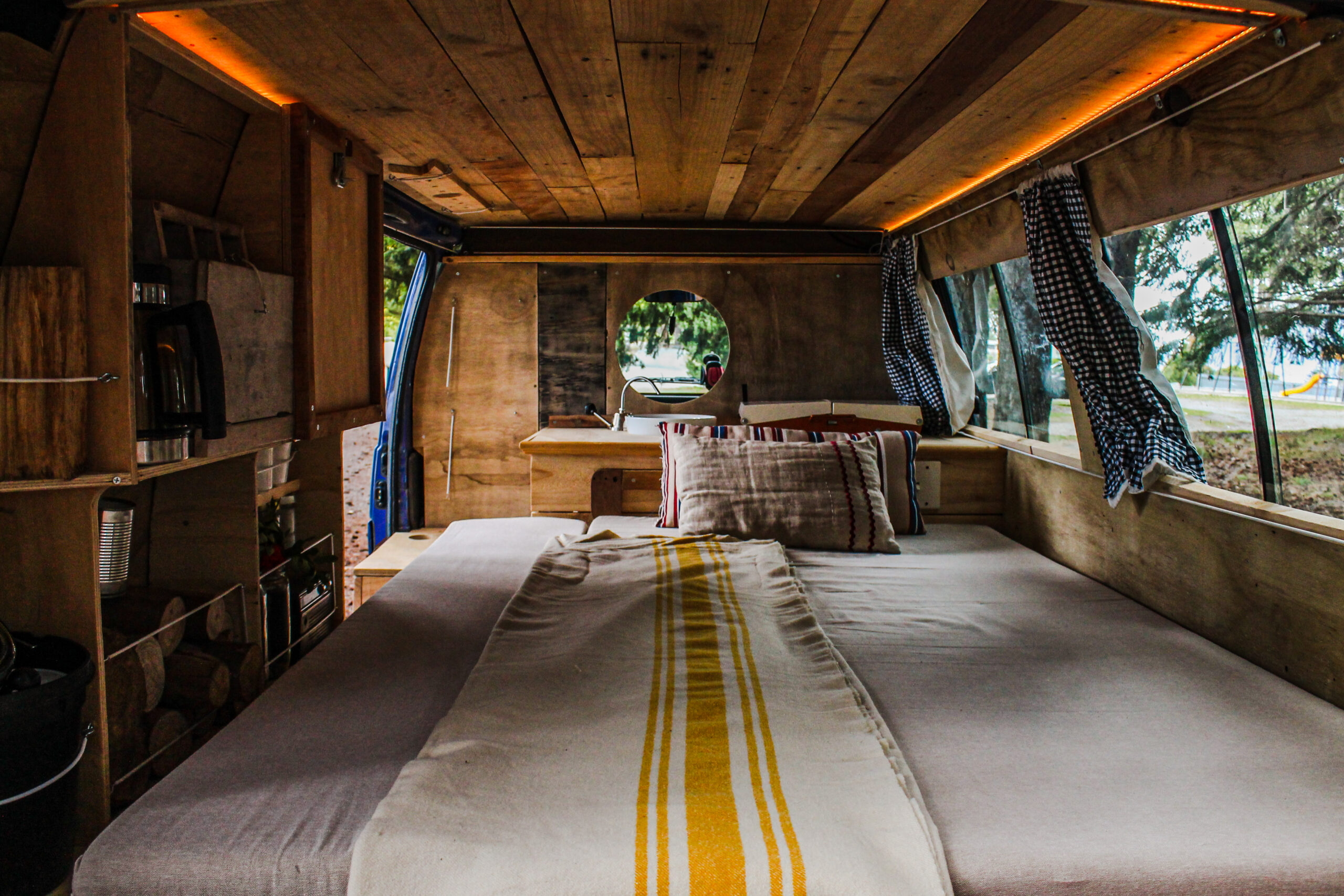 beautiful-view-bed-inside-vintage-wooden-van
